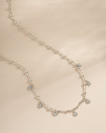 Sterling silver dangling tear drop necklace by Sami Jewels featuring a elegant drop pendant on a sleek chain.