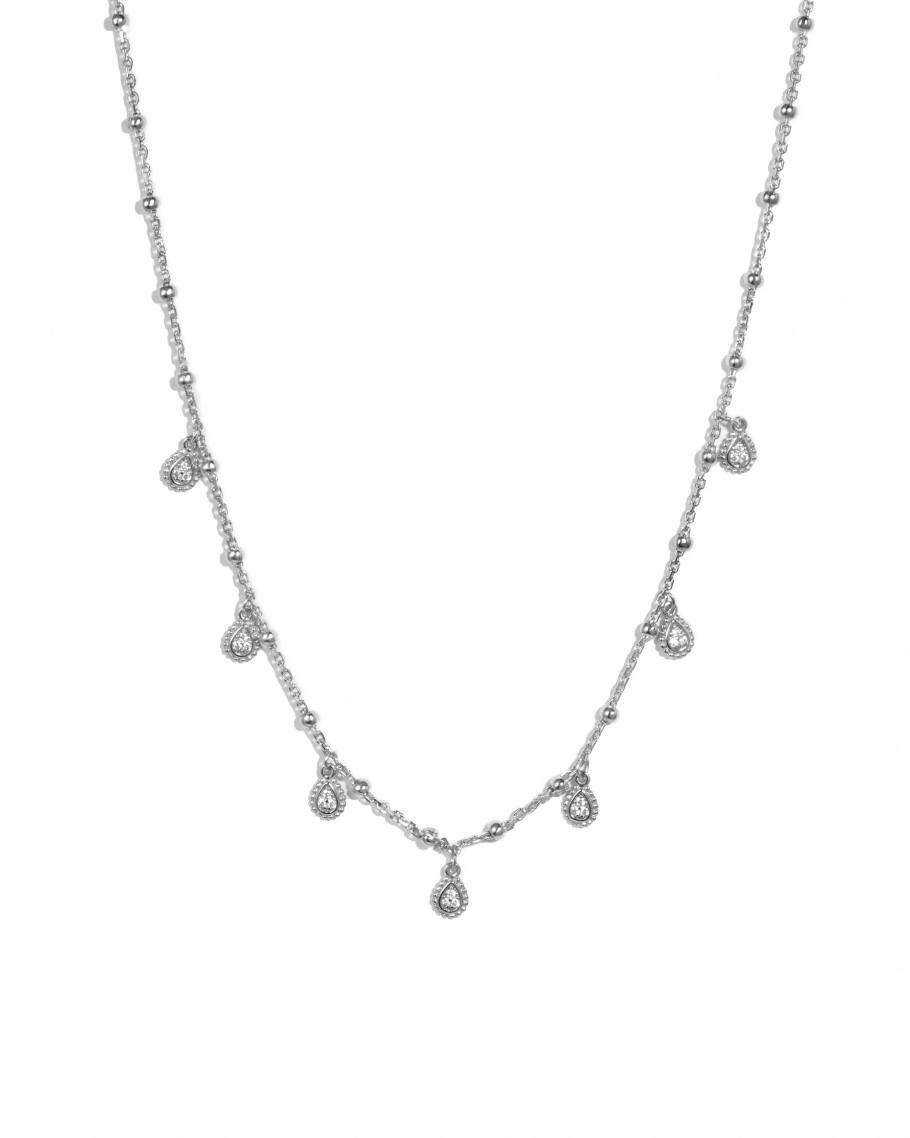 Sterling silver dangling teardrop necklace from Sami Jewels, featuring a elegant teardrop pendant on a delicate chain.