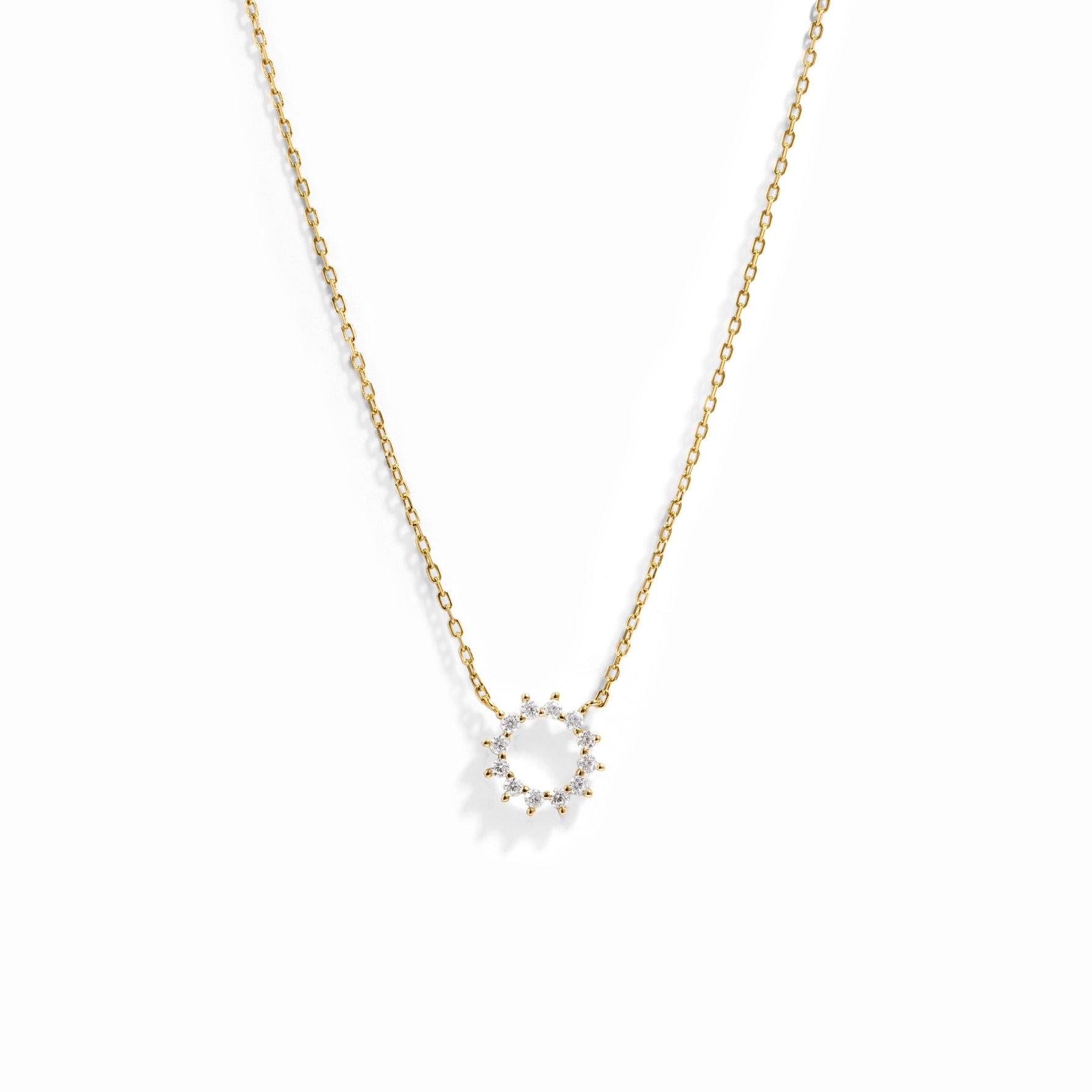 Dainty sunburst necklace on delicate chain in gold plating