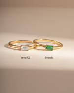 Diamond Lori Baguette Ring by Sami Jewels featuring a sparkling diamond baguette design with an emerald baguette accent.