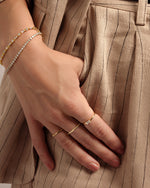 Gold Diamond Lori Baguette Ring by Sami Jewels, showcasing a sleek band with sparkling baguette-cut diamonds.
