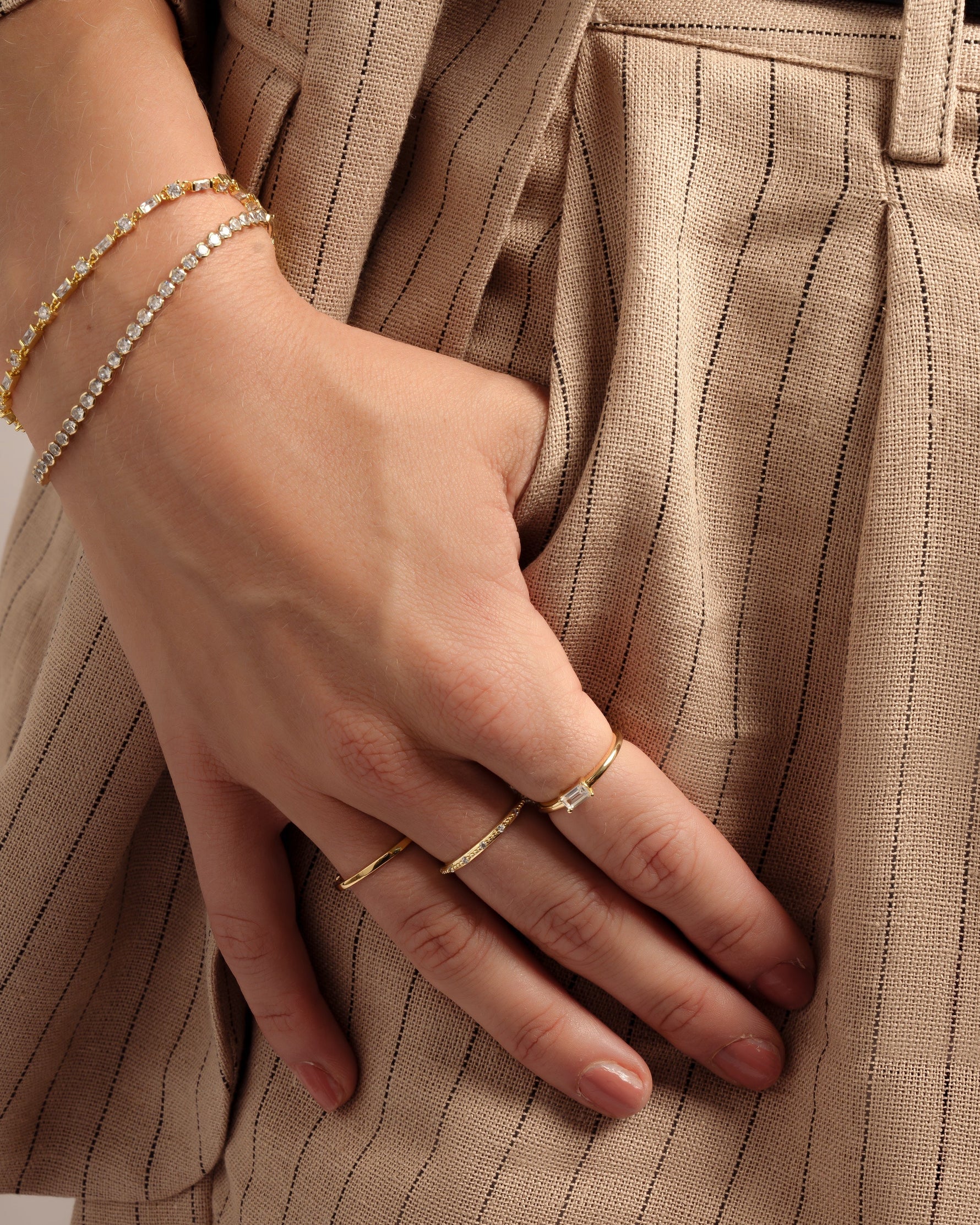 Gold Diamond Lori Baguette Ring by Sami Jewels, showcasing a sleek band with sparkling baguette-cut diamonds.