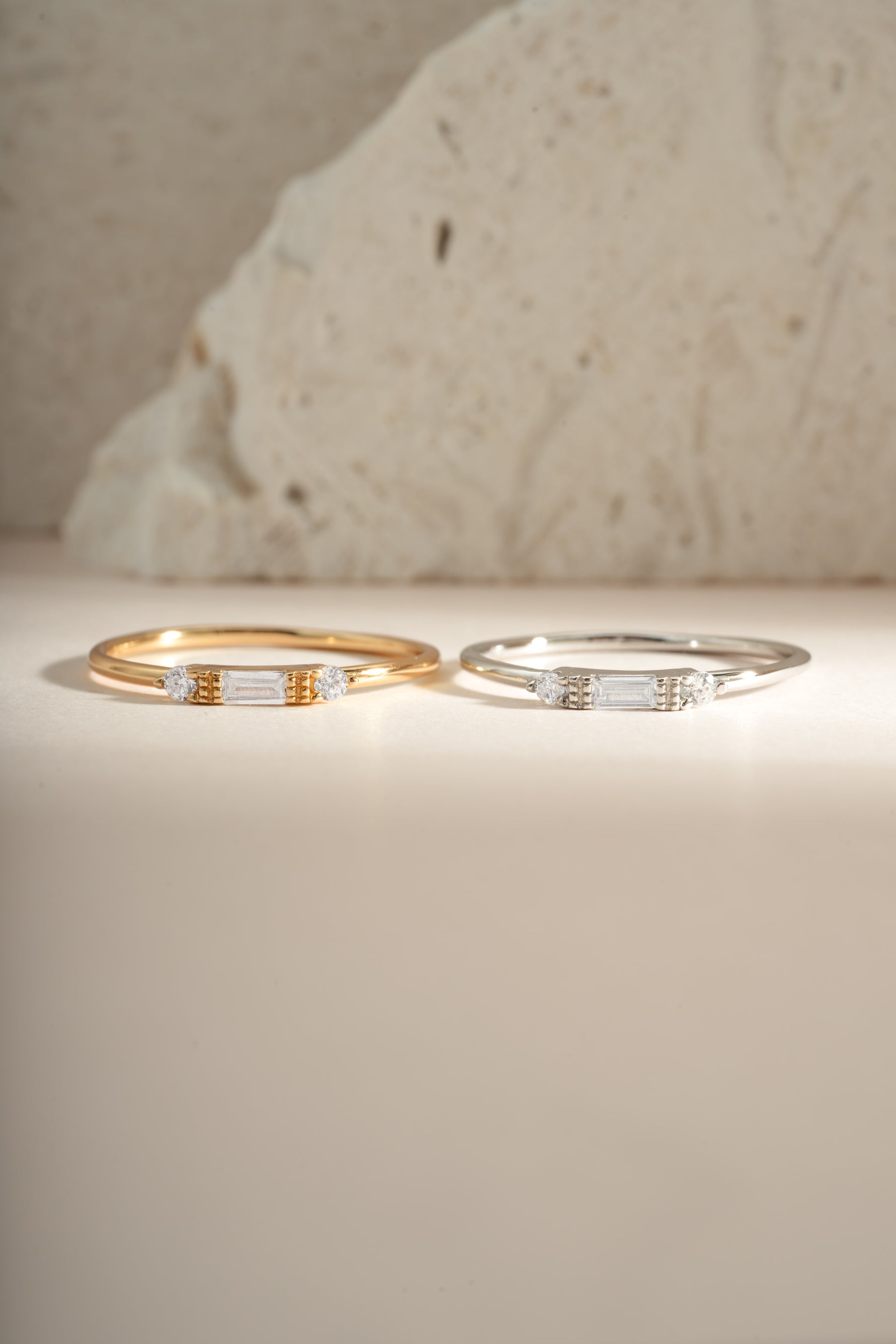 White CZ Baguette Ring by Sami Jewels, sterling silver and gold ring featuring a sparkling baguette-cut cubic zirconia centerpiece.