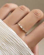 White CZ Baguette Ring by Sami Jewels featuring a sterling silver band with a row of sparkling baguette-cut cubic zirconia stones.
