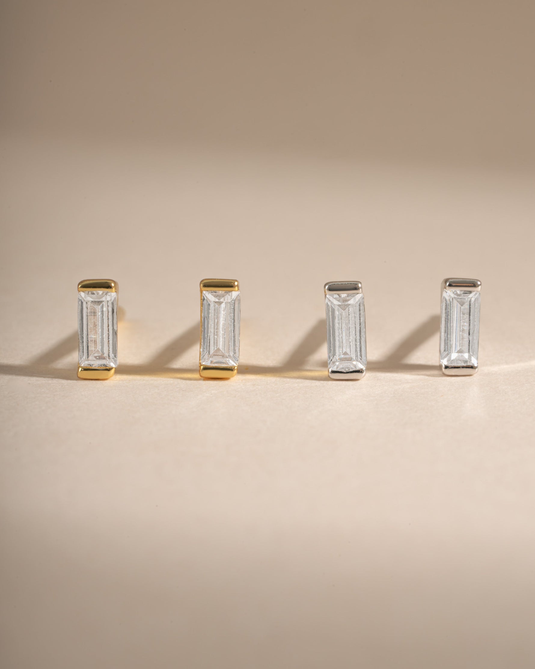 White CZ Baguette Stud Earrings by Sami Jewels, featuring sparkling diamond-cut baguette stones in gold and sterling silver.