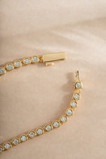 Gold diamond baguette tennis necklace with box clasp from Sami Jewels, featuring sparkling rectangular-cut diamonds.