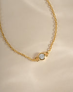 Close-up of Sami Jewels gold diamond bezel bracelet showcasing sparkling diamonds and elegant design.