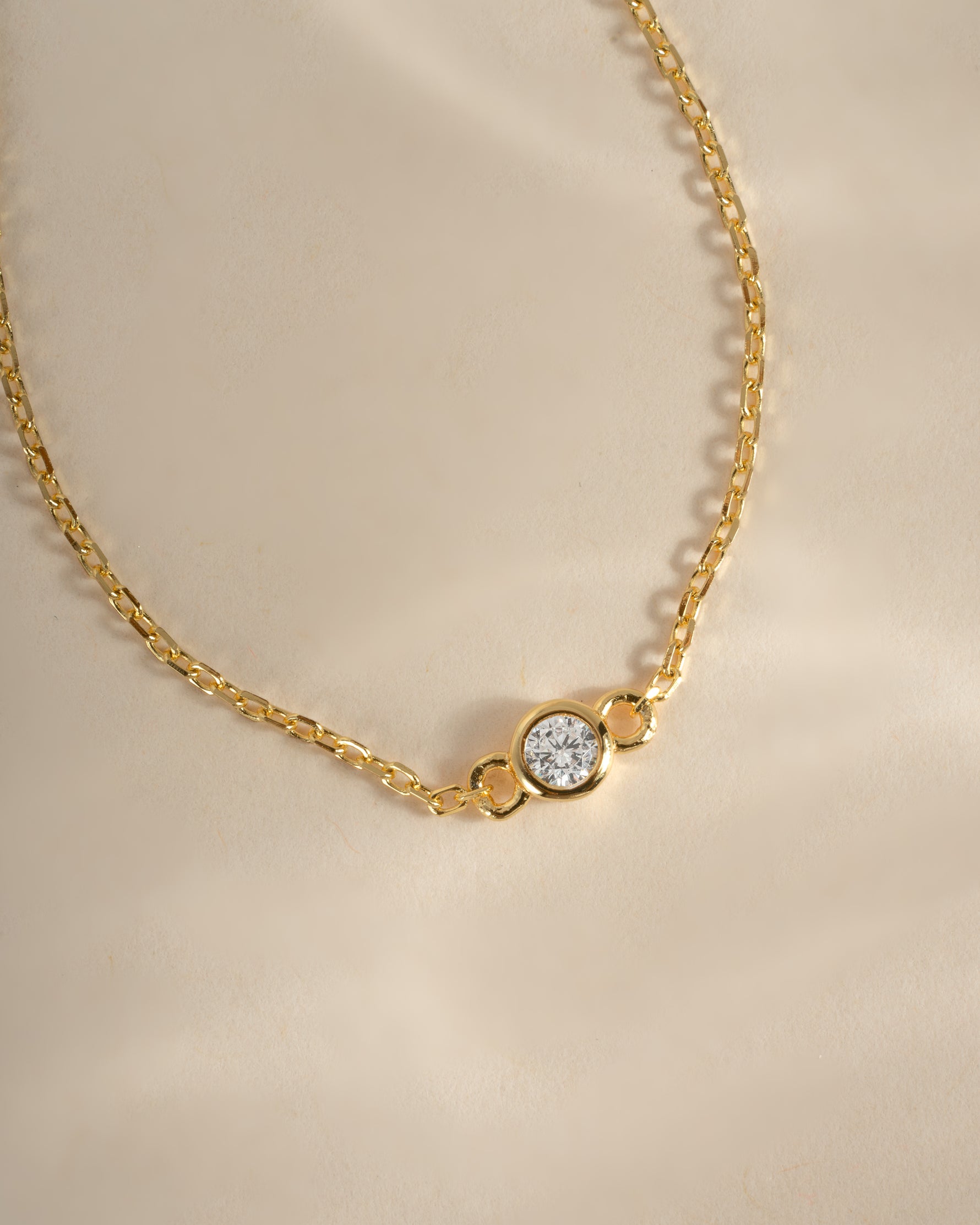 Close-up of Sami Jewels gold diamond bezel bracelet showcasing sparkling diamonds and elegant design.