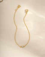 Gold diamond bezel bracelet by Sami Jewels featuring a elegant, sparkling diamond design on a sleek bracelet style.