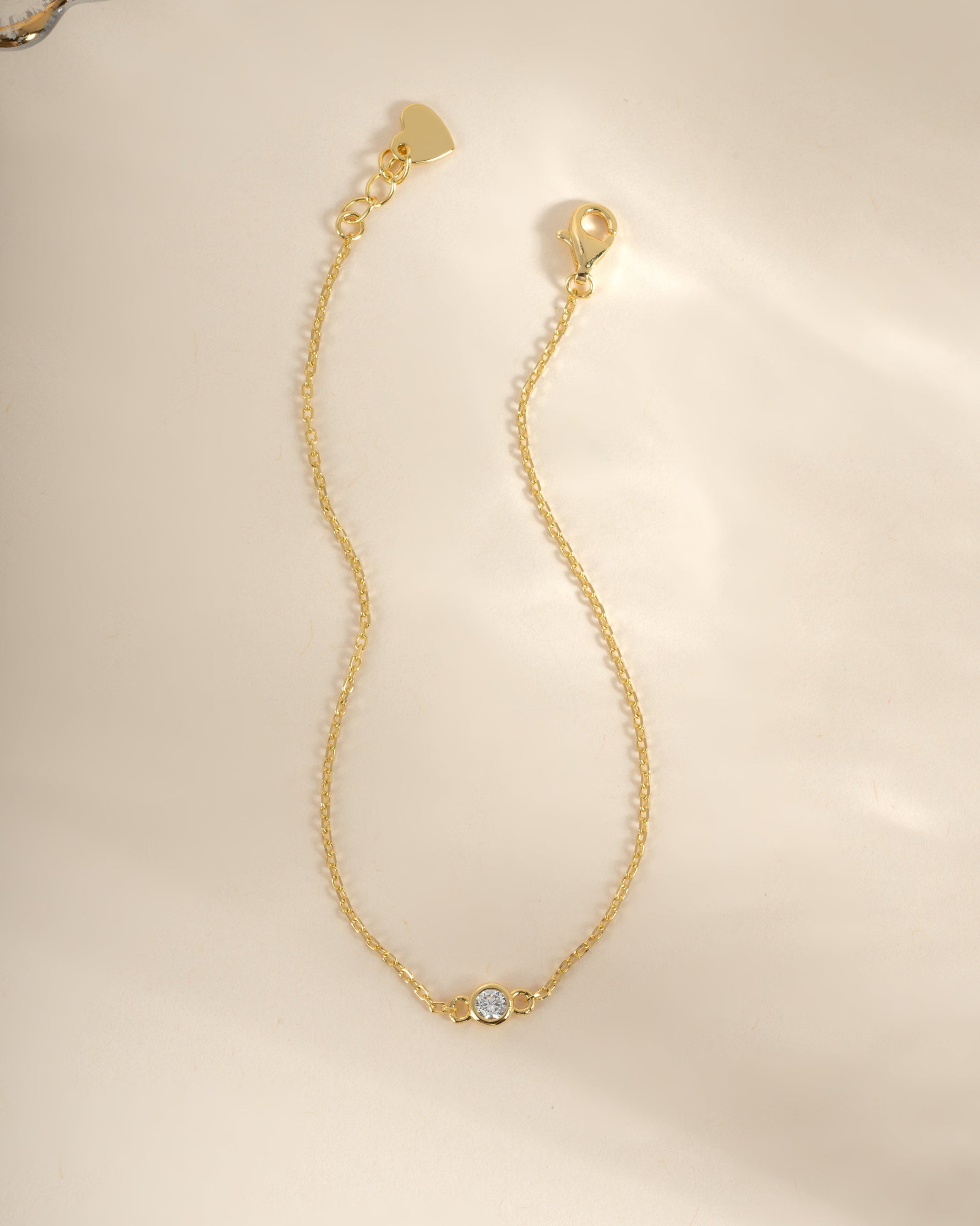 Gold diamond bezel bracelet by Sami Jewels featuring a elegant, sparkling diamond design on a sleek bracelet style.