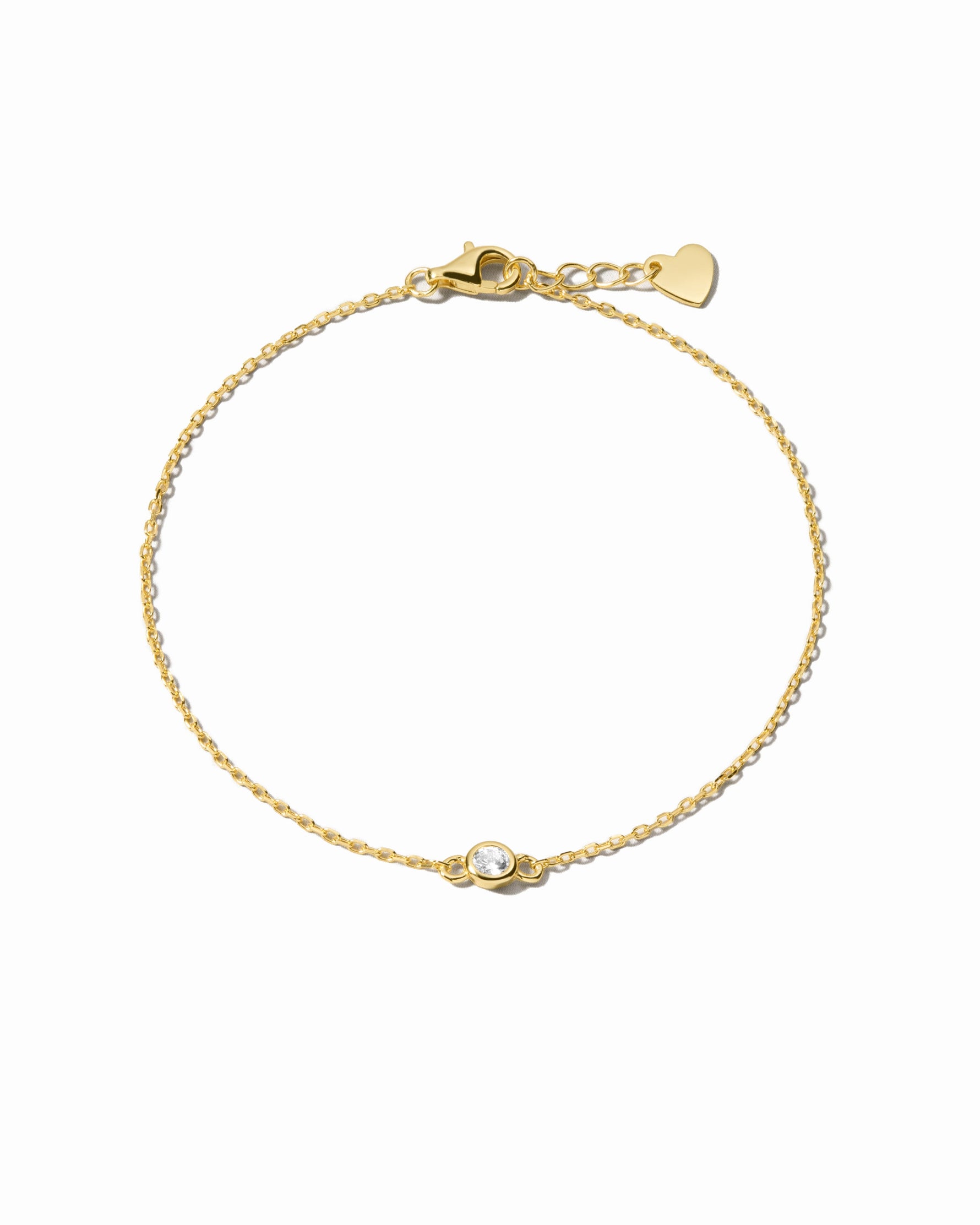Gold diamond bezel bracelet from Sami Jewels featuring a row of sparkling diamonds on a sleek bracelet design.