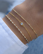 Gold diamond bezel bracelet stack by Sami Jewels, featuring elegant diamond accents and a sleek bracelet design.