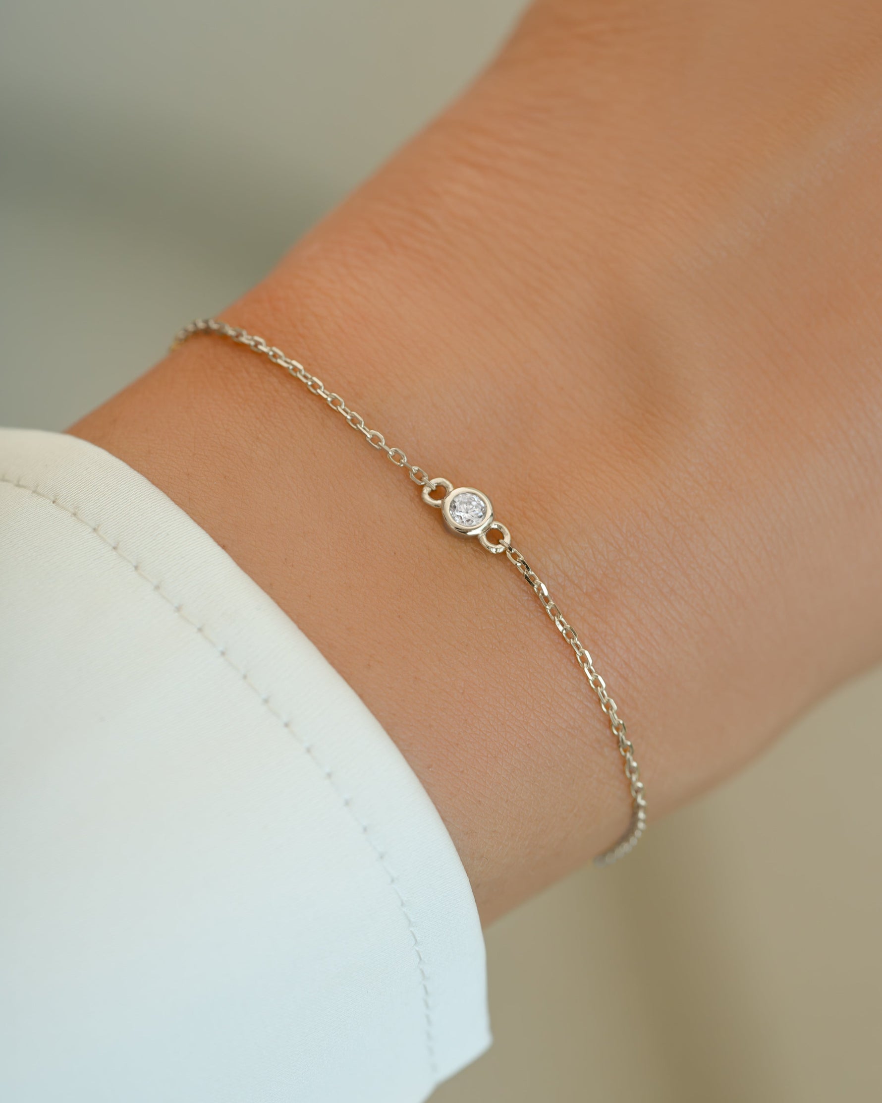 Sterling silver diamond bezel bracelet by Sami Jewels featuring a sleek design with sparkling diamonds and a secure clasp.