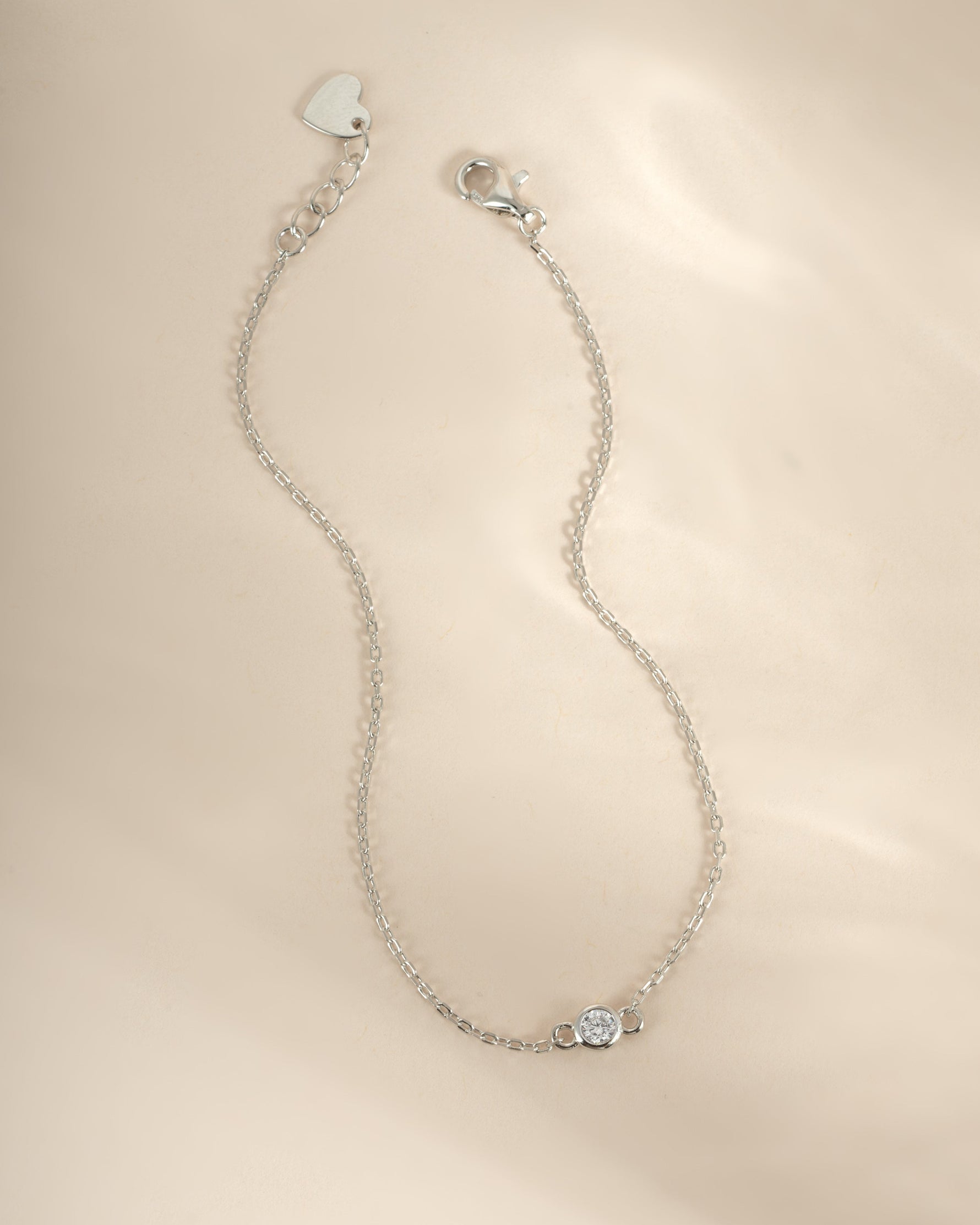 Sterling silver diamond bezel bracelet by Sami Jewels featuring a row of sparkling diamonds on a sleek bracelet.