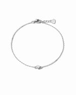 Sami Jewels diamond bezel bracelet with sterling silver band, featuring sparkling diamonds on a white background.