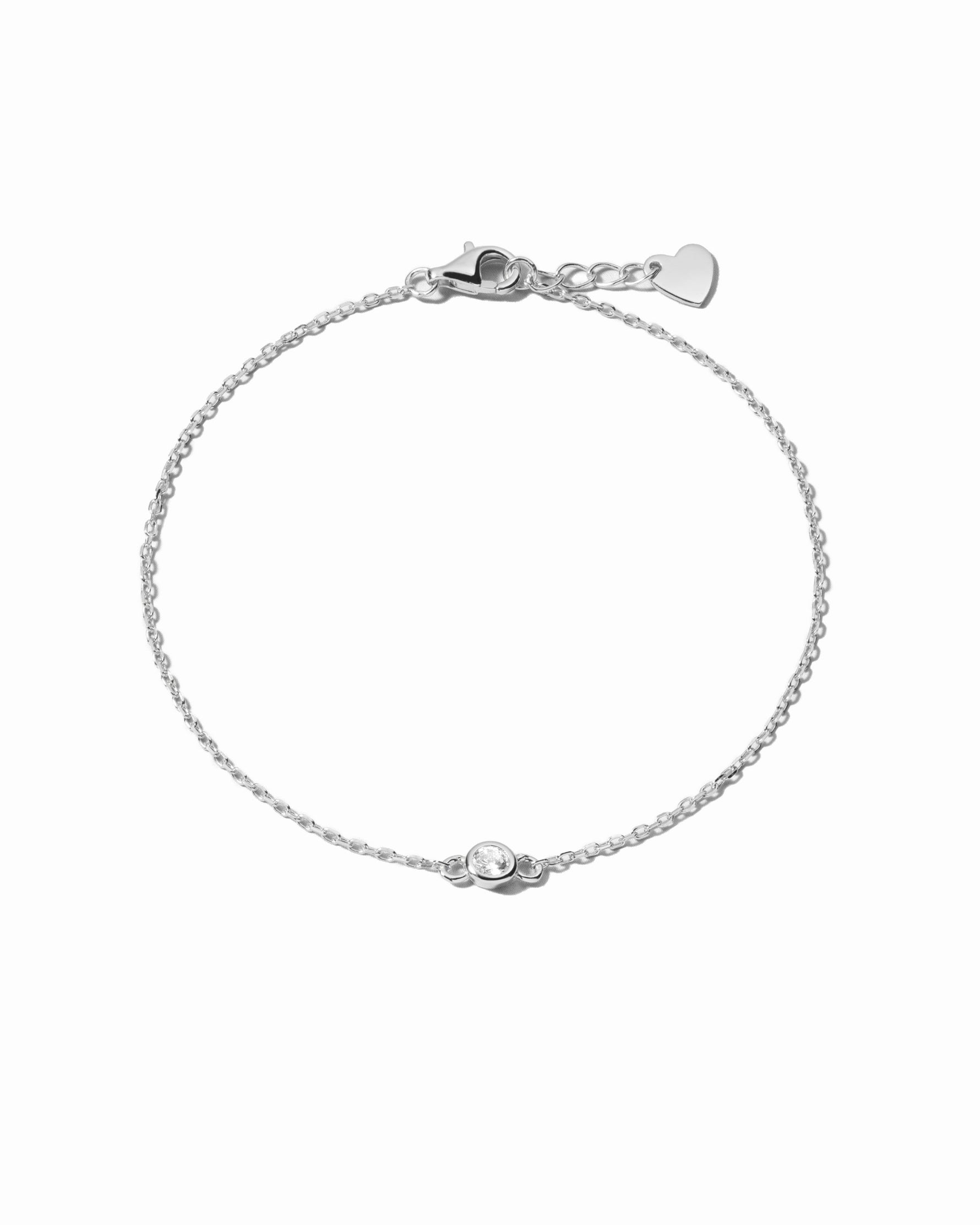 Sami Jewels diamond bezel bracelet with sterling silver band, featuring sparkling diamonds on a white background.