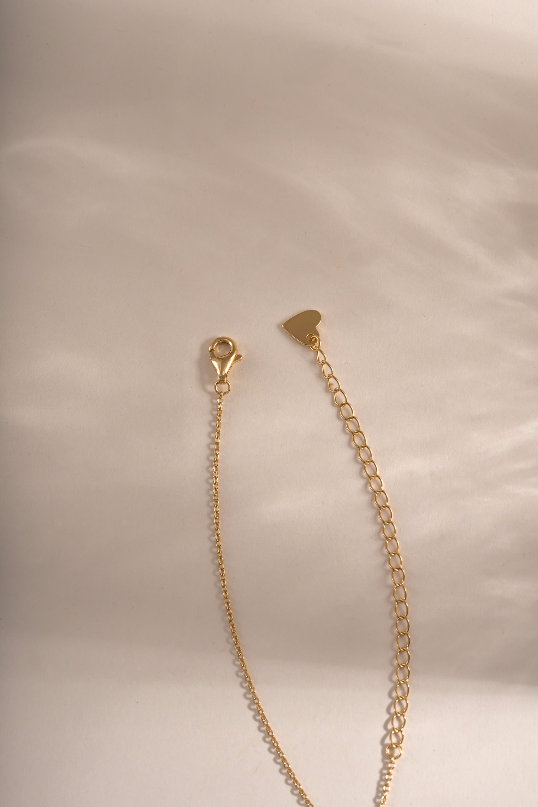 Gold Tiny Bezel Necklace by Sami Jewels featuring a delicate diamond bezel pendant with lobster clasp closure.