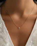 Gold Tiny Bezel Necklace by Sami Jewels featuring a delicate diamond bezel pendant on a fine chain.