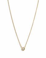Gold tiny bezel necklace with a diamond accent from Sami Jewels, displayed on a white background.