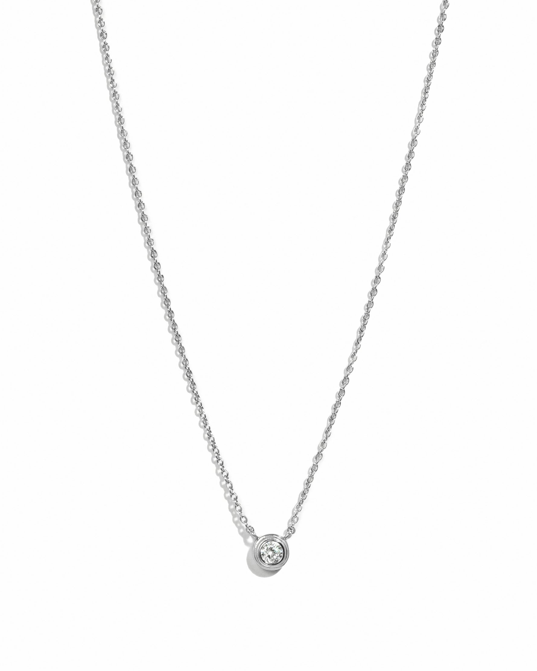Sterling silver Tiny Bezel Necklace by Sami Jewels featuring a small diamond bezel pendant on a delicate chain.
