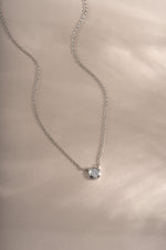 Sterling silver Tiny Bezel Necklace by Sami Jewels featuring a delicate diamond bezel pendant on a fine chain.