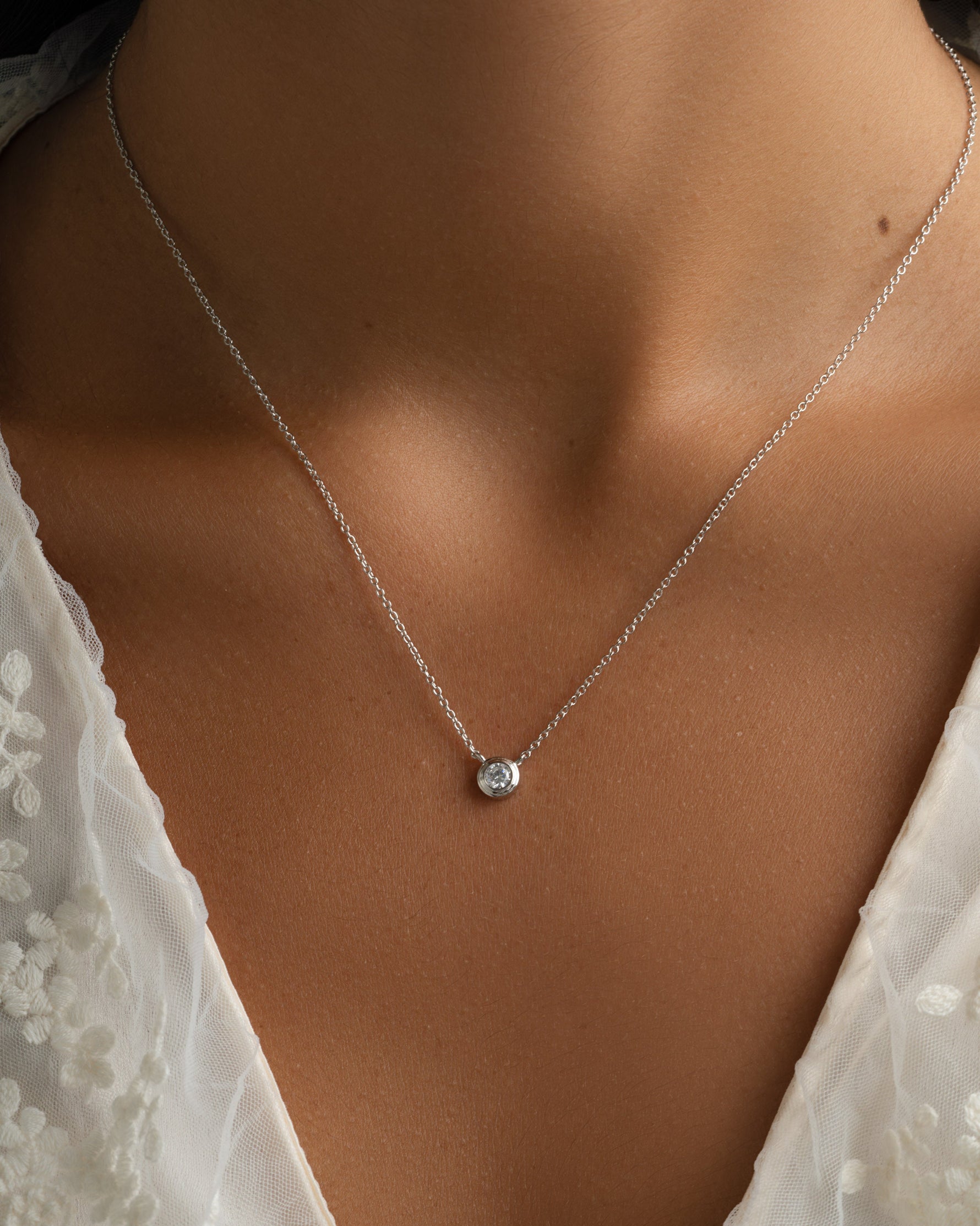 Sterling silver Tiny Bezel Necklace by Sami Jewels featuring a delicate diamond bezel pendant.