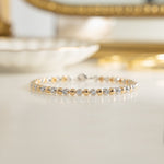 Handmade bracelet with alternating bead and diamond design.