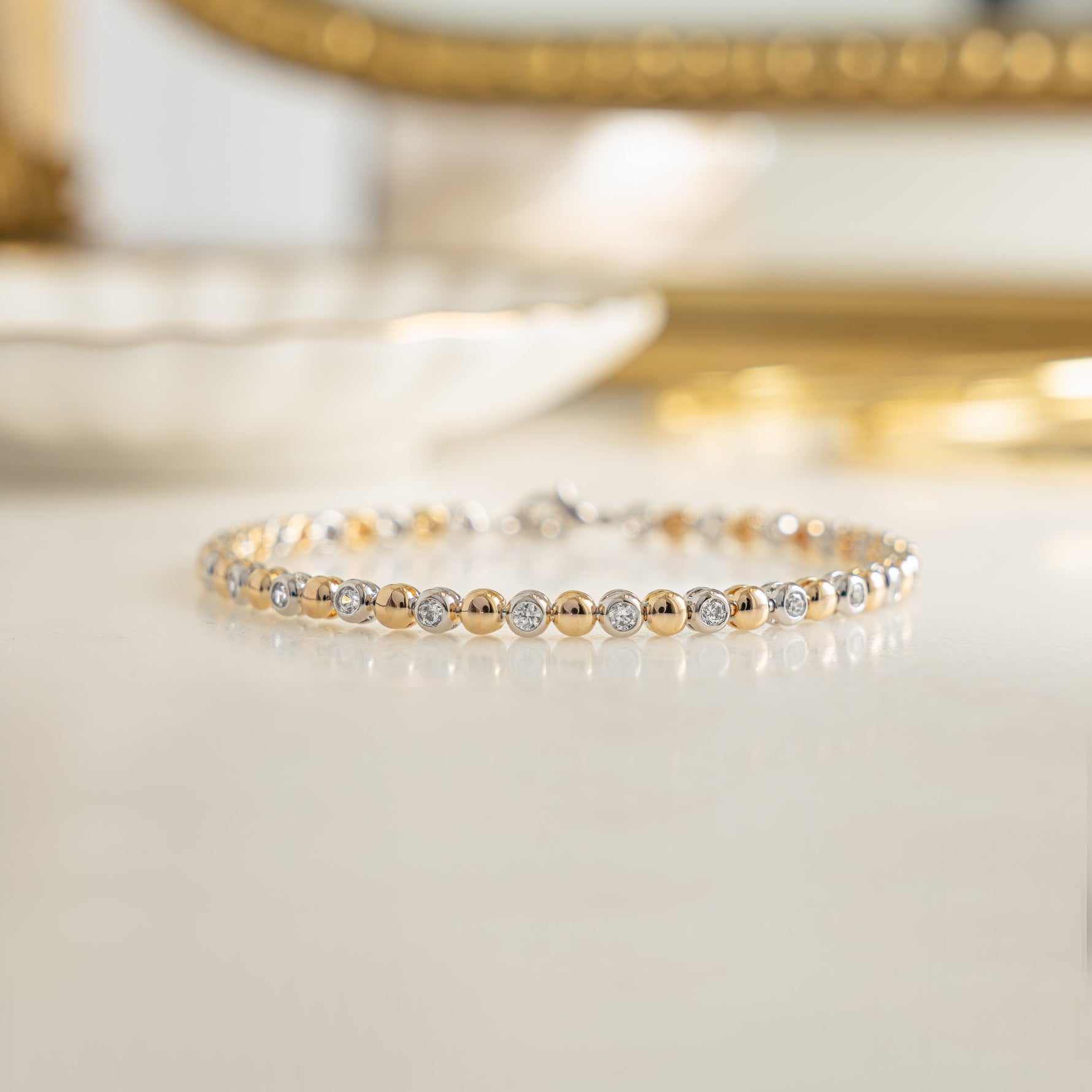 Handmade bracelet with alternating bead and diamond design.