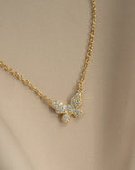 Close-up of Sami Jewels gold butterfly necklace with diamond accents, showcasing intricate design and delicate craftsmanship.