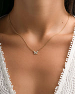 Gold butterfly necklace by Sami Jewels featuring a delicate diamond butterfly pendant on a fine chain.