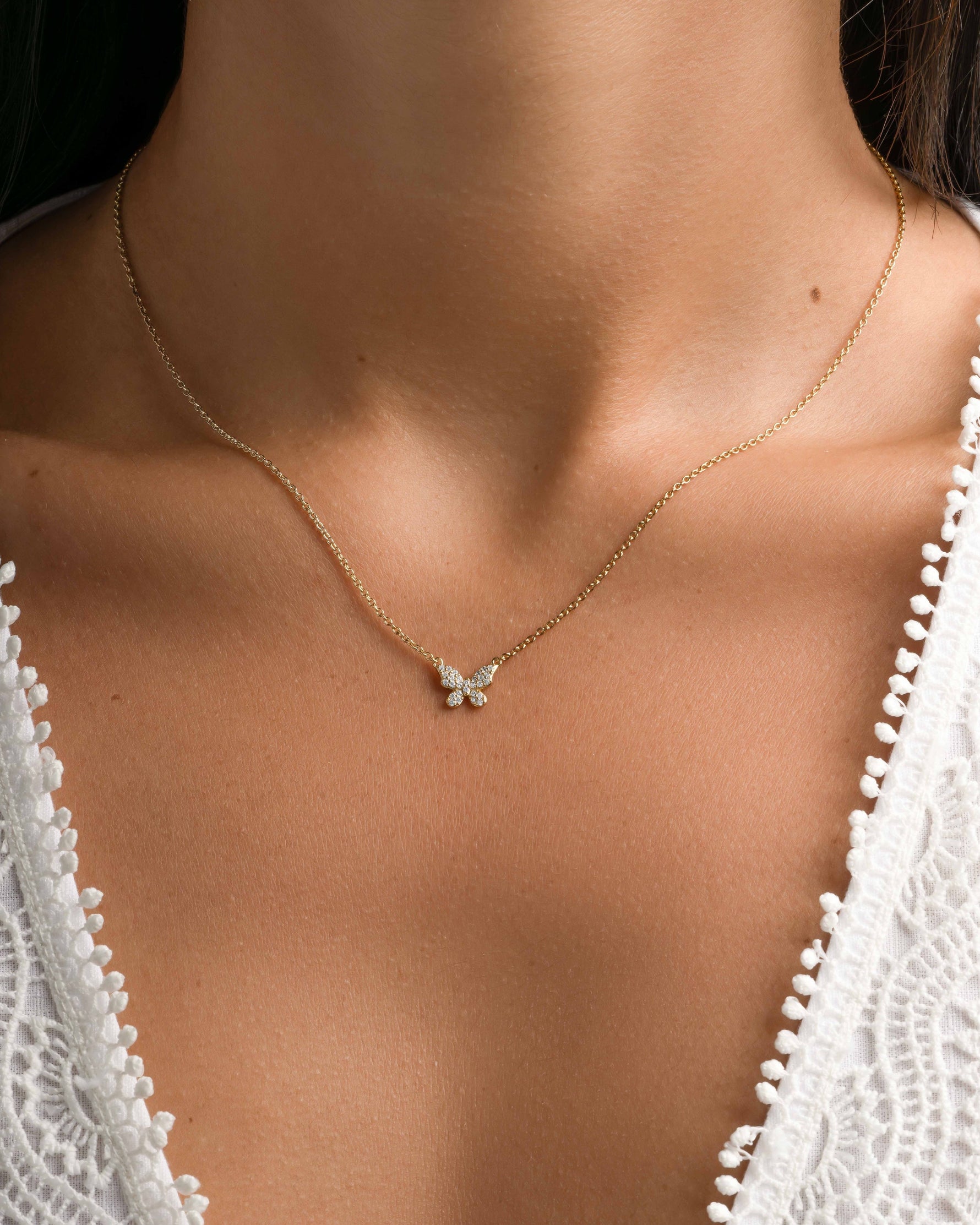 Gold butterfly necklace by Sami Jewels featuring a delicate diamond butterfly pendant on a fine chain.