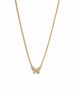 Gold butterfly necklace by Sami Jewels featuring a diamond-accented butterfly pendant on a white background.