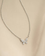 Close-up of Sami Jewels silver butterfly necklace with sparkling diamond accents, showcasing intricate design and sterling silver finish.