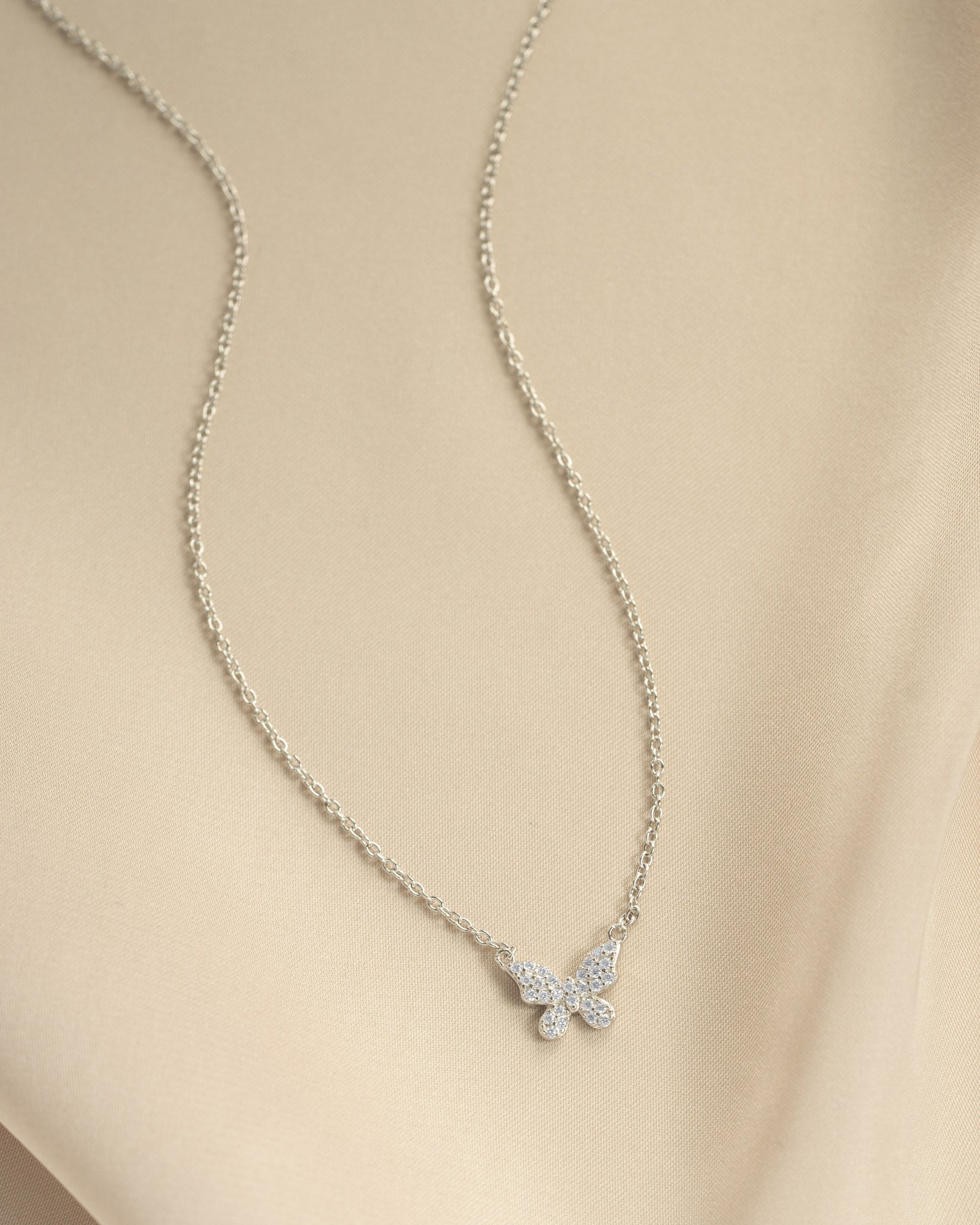 Sterling silver butterfly necklace with diamond accents from Sami Jewels, front view showing intricate butterfly pendant.