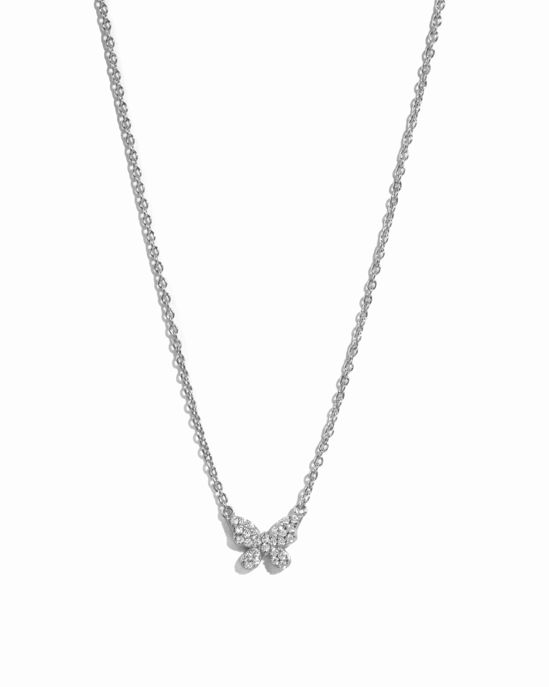 Sterling silver butterfly necklace by Sami Jewels featuring diamond accents, displayed against a white background.