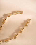 Gold Lilly tennis bracelet by Sami Jewels featuring a diamond chain and secure clasp.