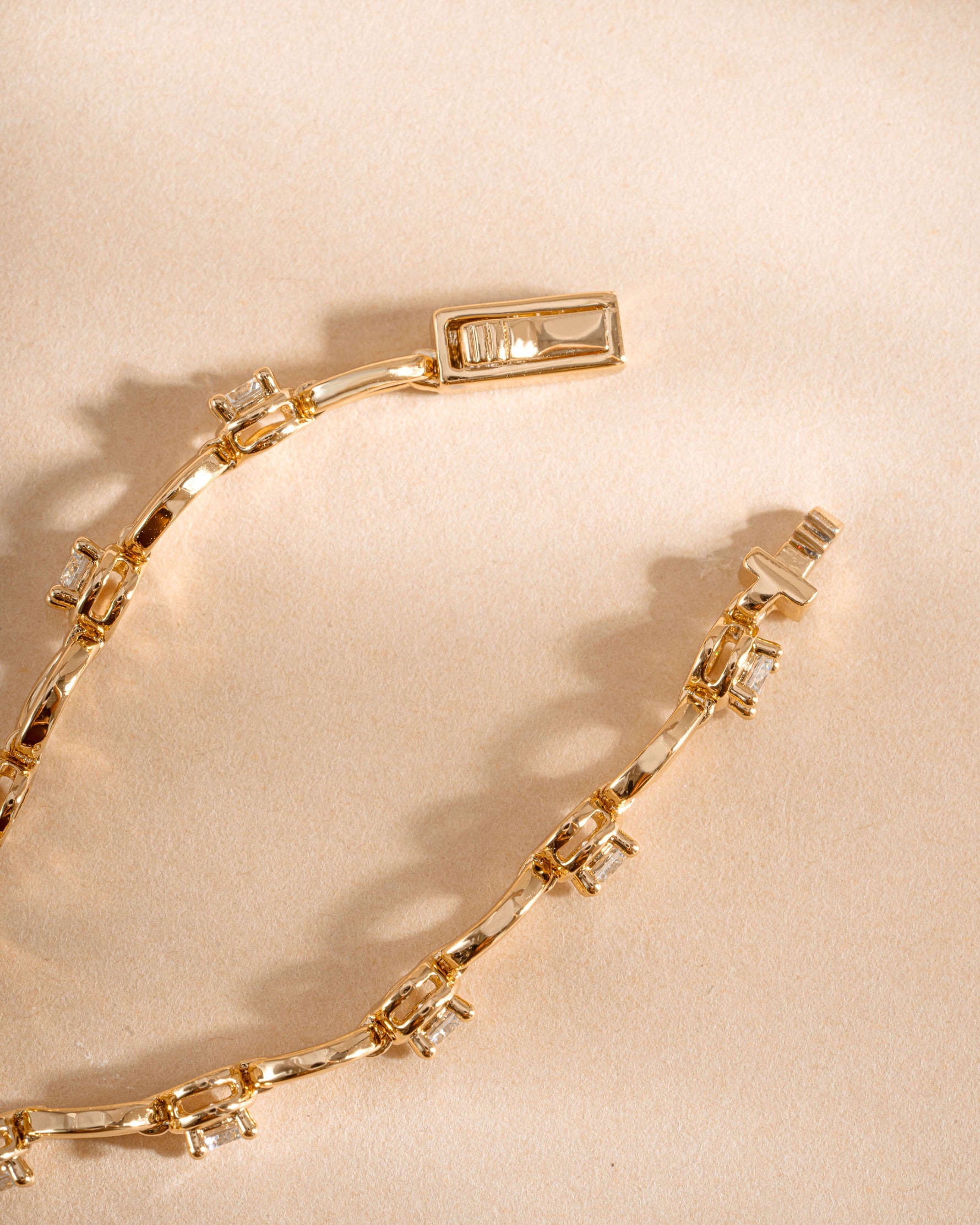Gold Lilly tennis bracelet by Sami Jewels featuring a diamond chain and secure clasp.