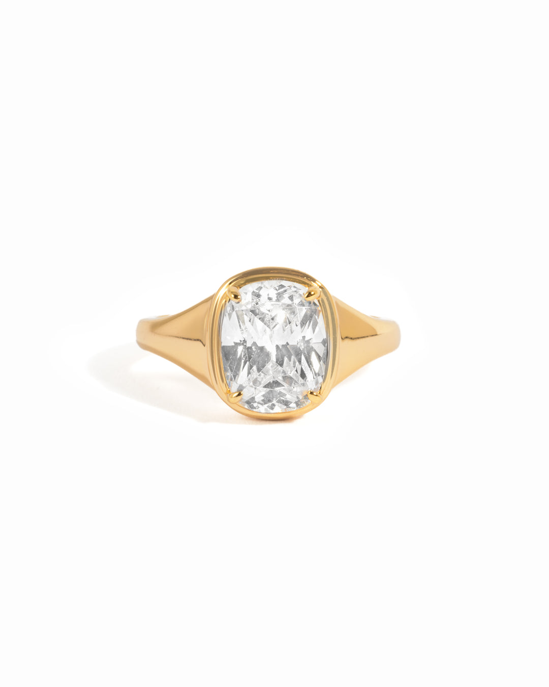 Gold elongated cushion ring with a diamond centerpiece, featuring a sleek and elegant design by Sami Jewels.