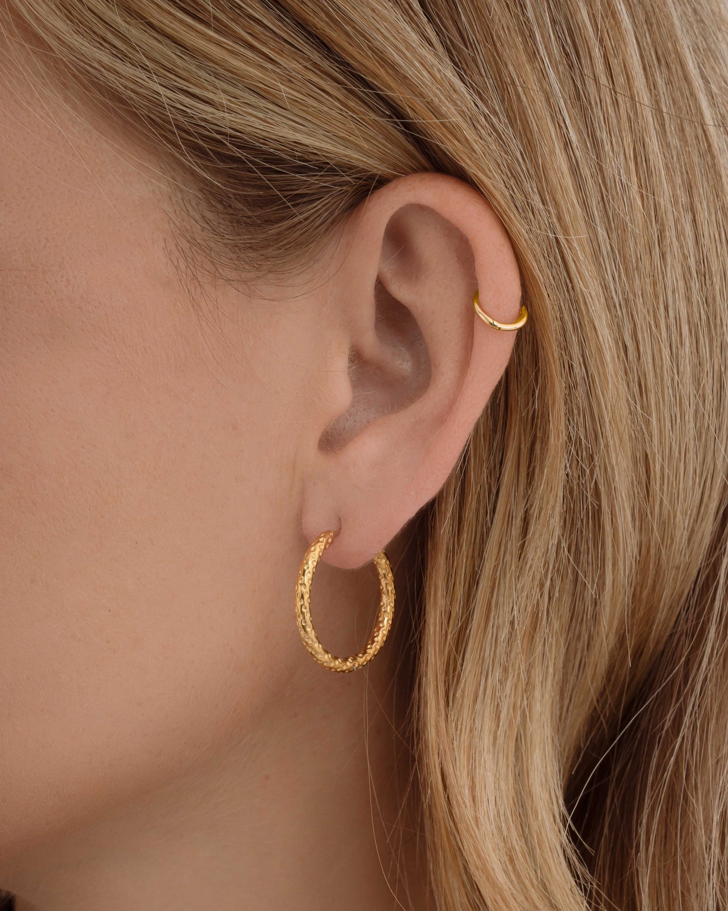 Gold stainless steel SS textured hoop earrings with diamond-cut design, waterproof Sami Jewels earrings for a stylish look.