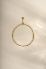 Gold Sami Jewels diamond-cut rope chain bracelet with intricate link design, showcasing shiny, textured surface.