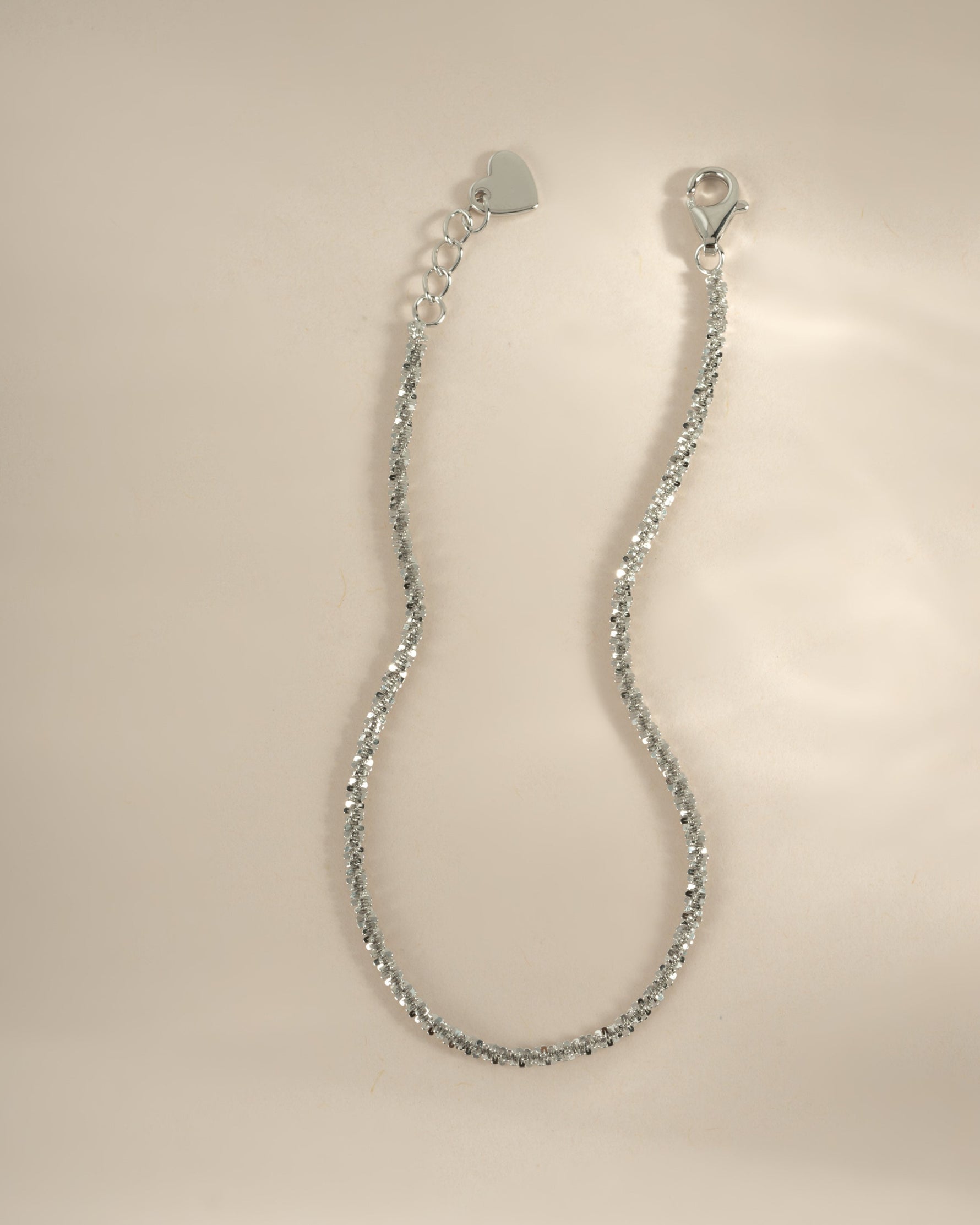 Close-up of a sterling silver diamond cut rope chain bracelet by Sami Jewels, showcasing intricate chain details.