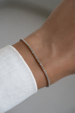 Sterling silver diamond cut rope chain bracelet by Sami Jewels featuring intricate twisted design and polished finish.