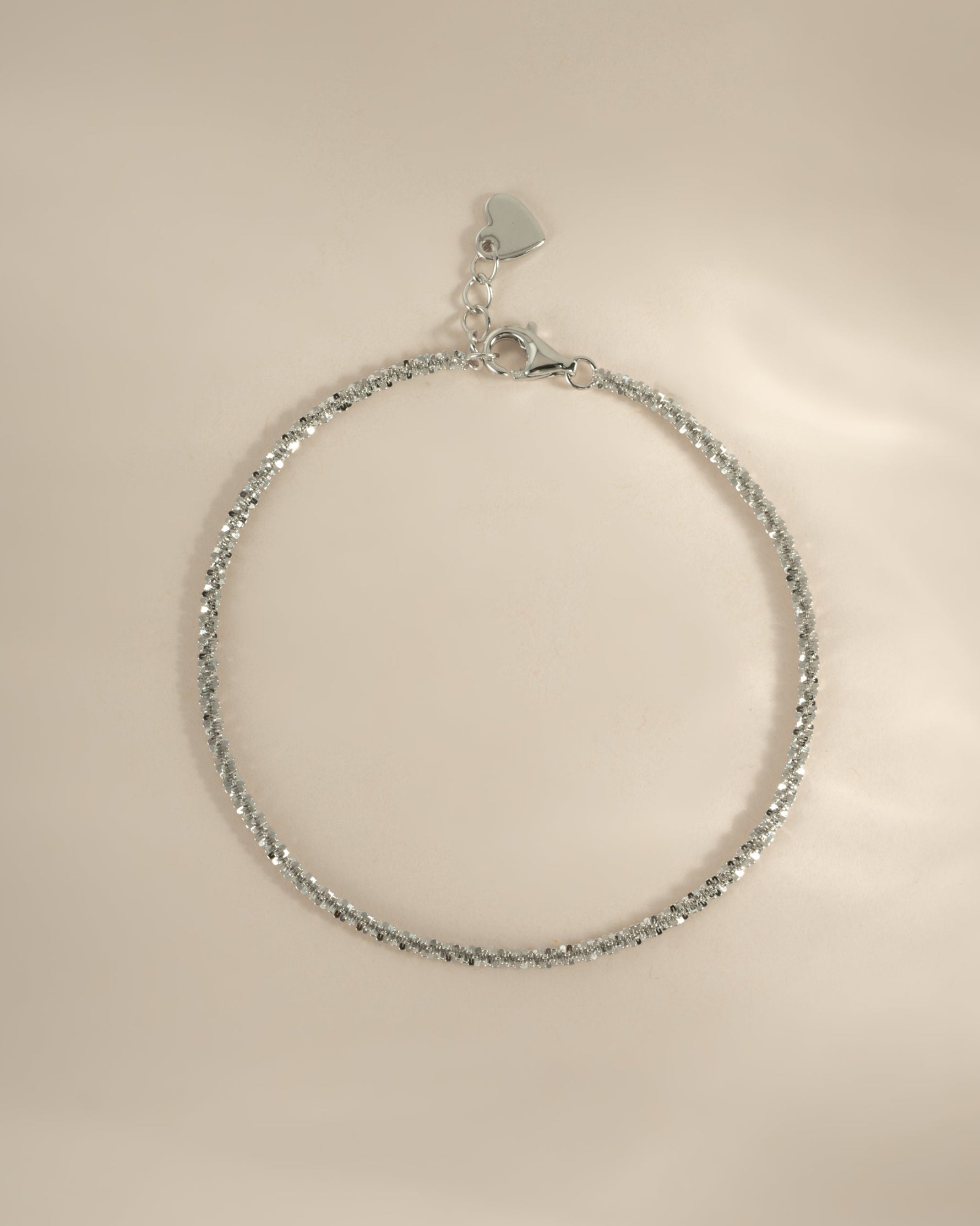 Sterling silver diamond-cut rope chain bracelet by Sami Jewels showcasing intricate textured links.