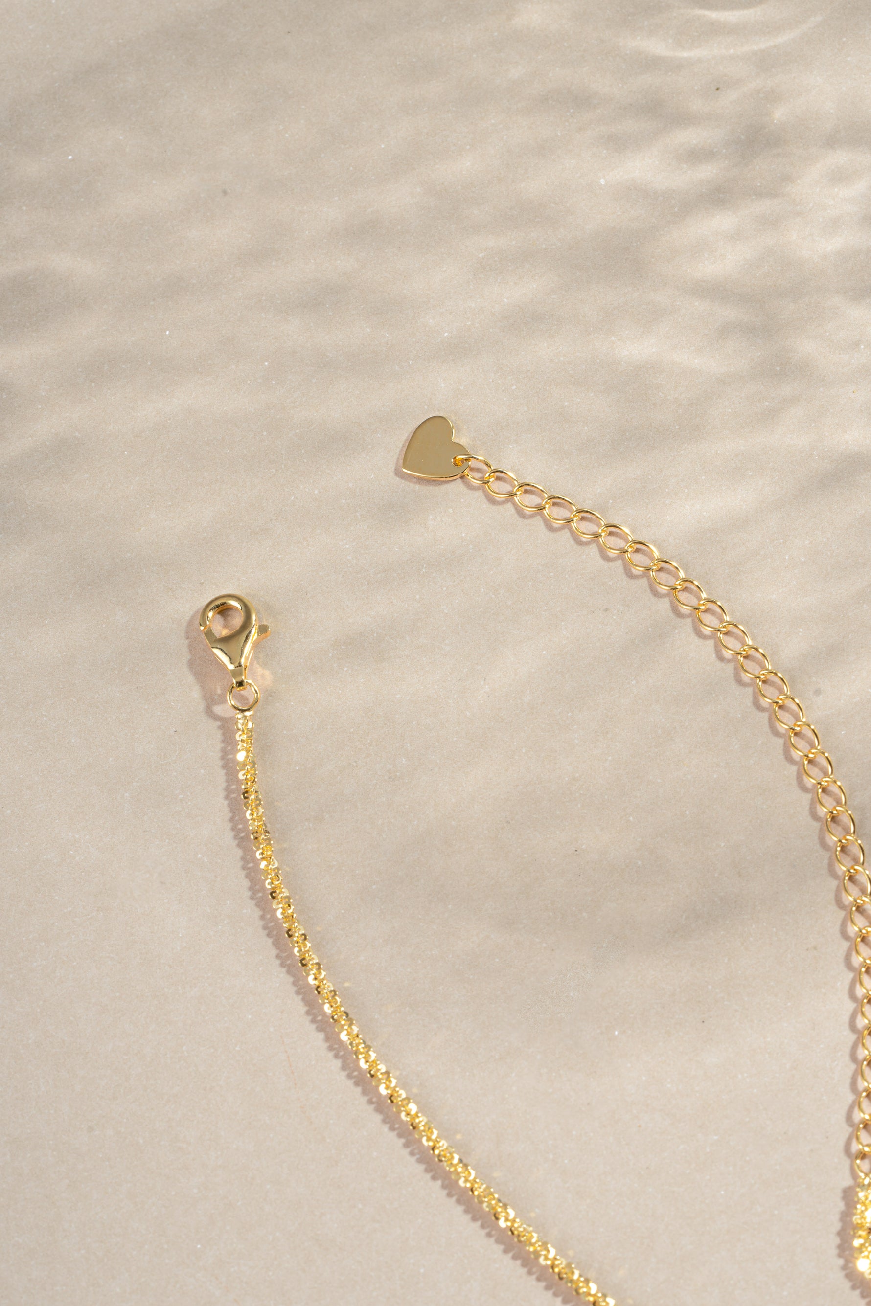 Gold diamond cut rope chain necklace with lobster clasp closure, crafted by Sami Jewels.