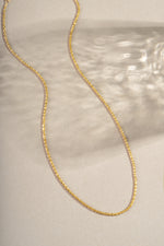 Gold diamond cut rope chain necklace from Sami Jewels, showcasing its intricate twisted design and shiny polished finish.