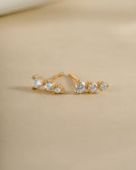 Gold CZ ear climber earrings by Sami Jewels, side view showing sparkling diamond accents and elegant curved design.