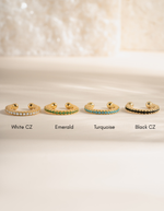 Turquoise ear cuff earrings by Sami Jewels featuring a diamond and gemstone design in a close-up image.