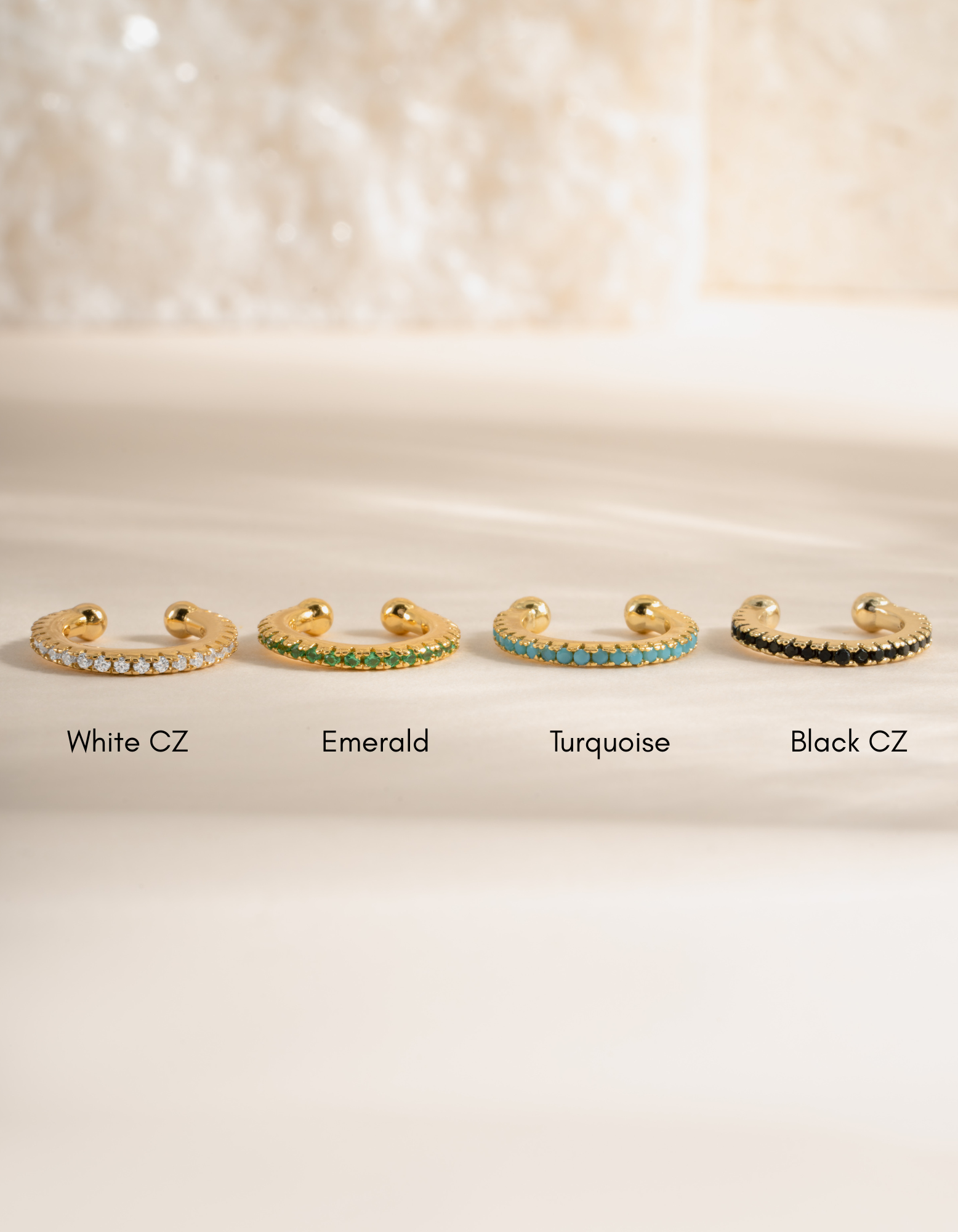 Turquoise ear cuff earrings by Sami Jewels featuring a diamond and gemstone design in a close-up image.