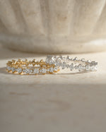 Sami Jewels Rebecca Eternity Ring featuring a gold and sterling silver band with sparkling diamond accents.