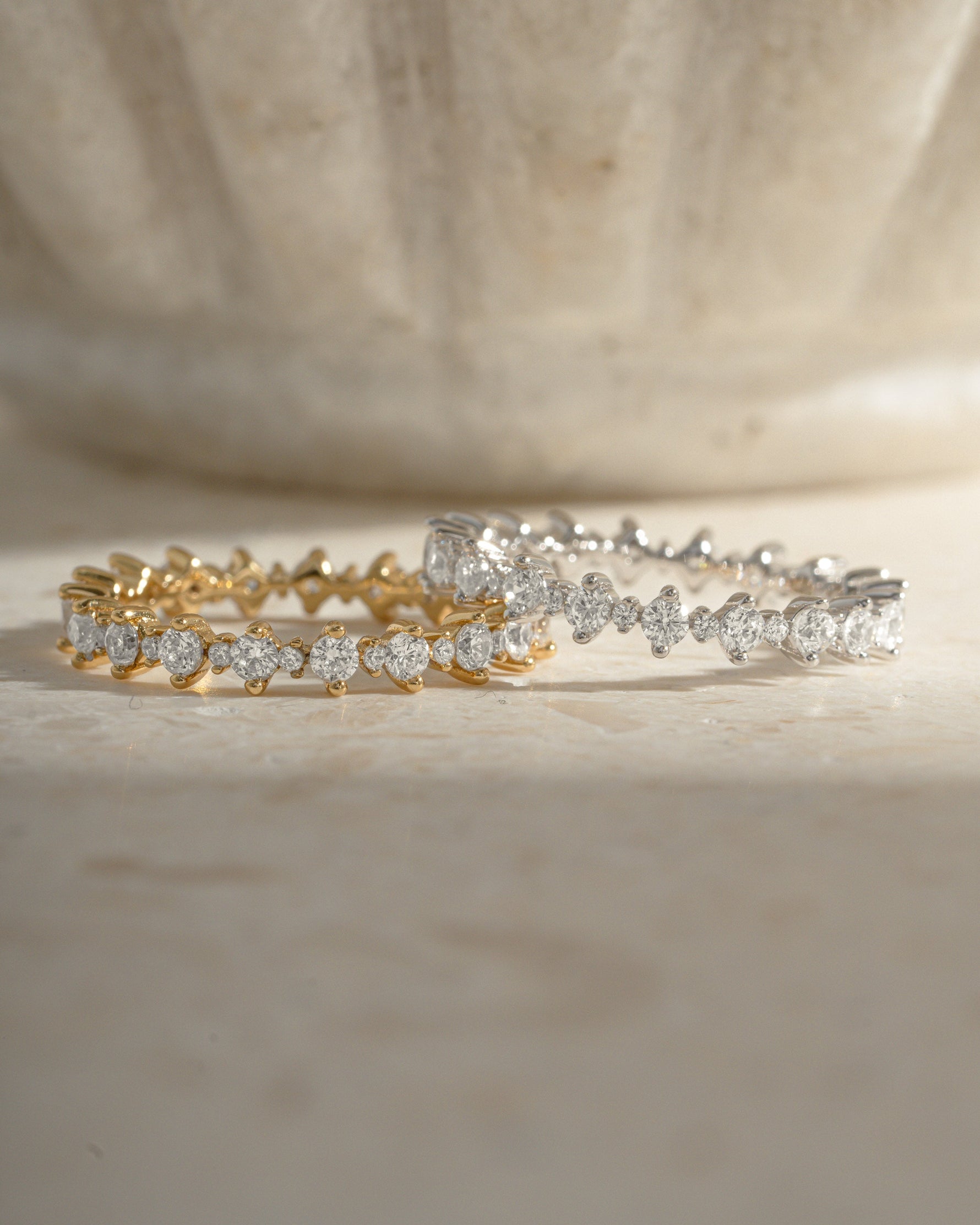 Sami Jewels Rebecca Eternity Ring featuring a gold and sterling silver band with sparkling diamond accents.